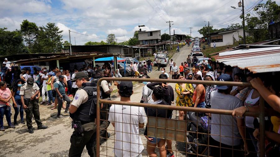 Family members of inmates gather outside the Santo Domingo de los Tsachilas prison after Ecuadorean authorities reported that they managed to put out a riot and recaptured several inmates that had escaped, in Santo Domingo, Ecuador May 9, 2022. REUTERS/Johanna Alarcon