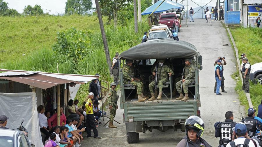 Soldiers patrol outside Bellavista prison where a deadly riot broke out overnight in Santo Domingo de los Tsachilas, Ecuador, Monday, May 9, 2022. (AP Photo/Dolores Ochoa)