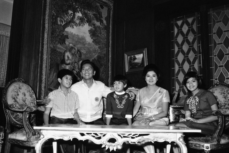 FILE- President Ferdinand Marcos of the Philippines, right, poses with his only son Ferdinand 'Bongbong