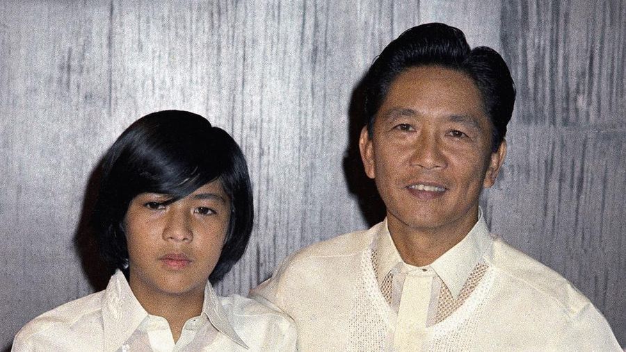 FILE- President Ferdinand Marcos of the Philippines, right, poses with his only son Ferdinand 'Bongbong