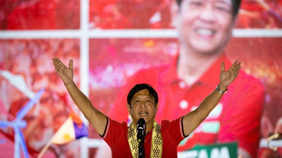 FILE- President Ferdinand Marcos of the Philippines, right, poses with his only son Ferdinand 'Bongbong
