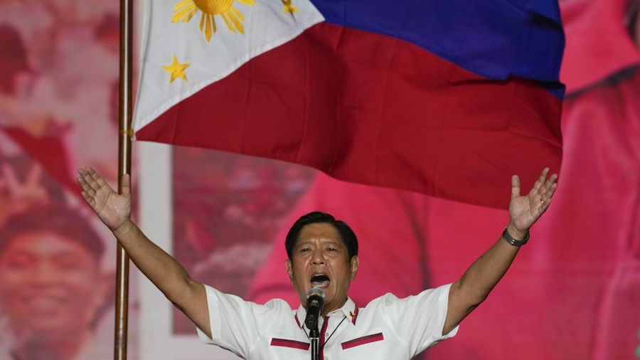 FILE- President Ferdinand Marcos of the Philippines, right, poses with his only son Ferdinand 'Bongbong