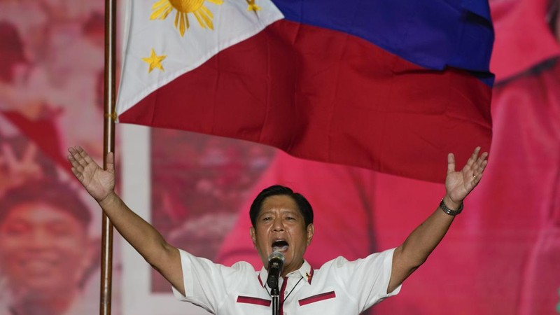 FILE- President Ferdinand Marcos of the Philippines, right, poses with his only son Ferdinand 'Bongbong
