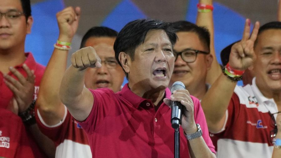 FILE- President Ferdinand Marcos of the Philippines, right, poses with his only son Ferdinand 'Bongbong