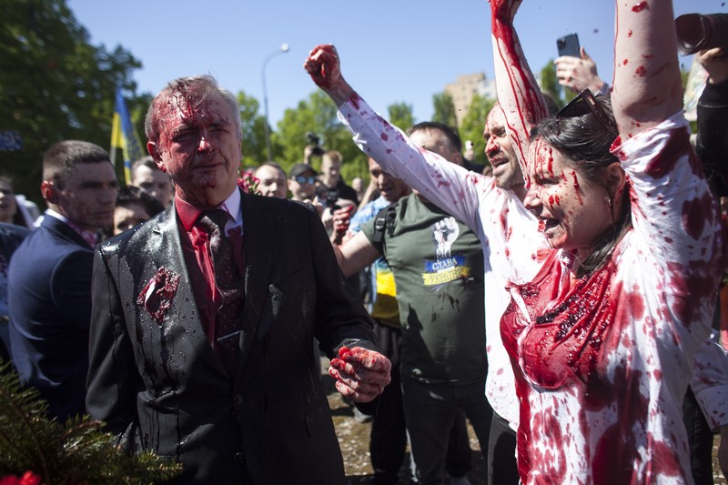 APTOPIX Poland Russia Ambassador Russian Ambassador to Poland, Ambassador Sergey Andreev is covered with red paint in Warsaw, Poland, Monday, May 9, 2022. Protesters have thrown red paint on the Russian ambassador as he arrived at a cemetery in Warsaw to pay respects to Red Army soldiers who died during World War II. Ambassador Sergey Andreev arrived at the Soviet soldiers cemetery on Monday to lay flowers where a group of activists opposed to Russia’s war in Ukraine were waiting for him. (AP Photo/Maciek Luczniewski)