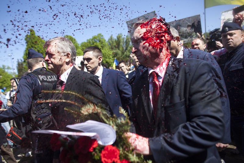 APTOPIX Poland Russia Ambassador Russian Ambassador to Poland, Ambassador Sergey Andreev is covered with red paint in Warsaw, Poland, Monday, May 9, 2022. Protesters have thrown red paint on the Russian ambassador as he arrived at a cemetery in Warsaw to pay respects to Red Army soldiers who died during World War II. Ambassador Sergey Andreev arrived at the Soviet soldiers cemetery on Monday to lay flowers where a group of activists opposed to Russia’s war in Ukraine were waiting for him. (AP Photo/Maciek Luczniewski)