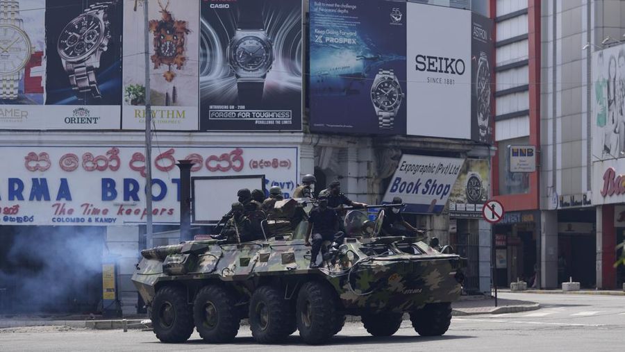 Army members travel on an armoured car on the main road after the curfew was extended for another extra day following a clash between Anti-government demonstrators and Sri Lanka's ruling party supporters, amid the country's economic crisis, in Colombo, Sri Lanka, May 11, 2022. REUTERS/Dinuka Liyanawatte