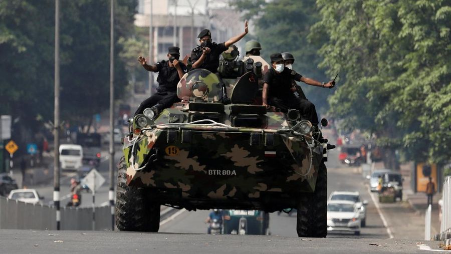Army members travel on an armoured car on the main road after the curfew was extended for another extra day following a clash between Anti-government demonstrators and Sri Lanka's ruling party supporters, amid the country's economic crisis, in Colombo, Sri Lanka, May 11, 2022. REUTERS/Dinuka Liyanawatte