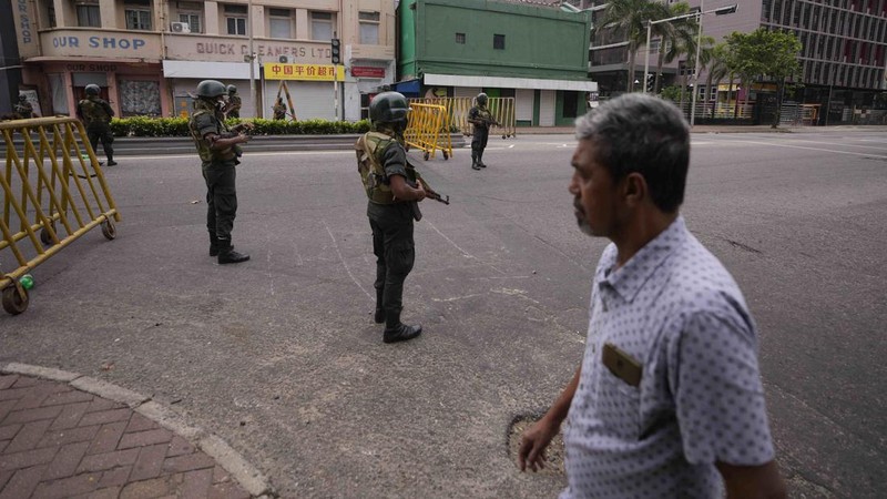 Army members travel on an armoured car on the main road after the curfew was extended for another extra day following a clash between Anti-government demonstrators and Sri Lanka's ruling party supporters, amid the country's economic crisis, in Colombo, Sri Lanka, May 11, 2022. REUTERS/Dinuka Liyanawatte