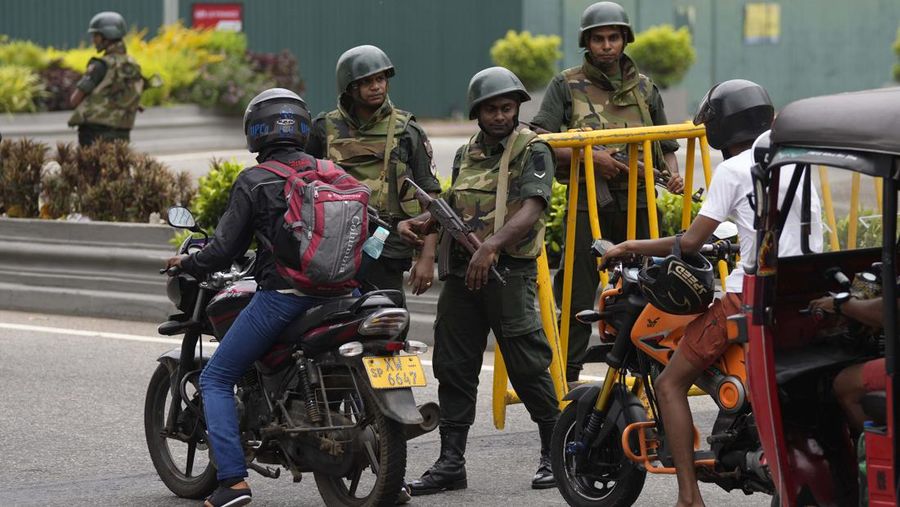 Army members travel on an armoured car on the main road after the curfew was extended for another extra day following a clash between Anti-government demonstrators and Sri Lanka's ruling party supporters, amid the country's economic crisis, in Colombo, Sri Lanka, May 11, 2022. REUTERS/Dinuka Liyanawatte