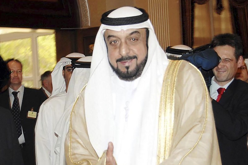 This photo made available by the Ministry of Presidential Affairs, shows UAE Crown Prince Sheikh Mohamed bin Zayed Al Nahyan, ruler of Abu Dhabi, front right, and Sheikh Mansour bin Zayed Al Nahyan, UAE Deputy Prime Minister and Minister of Presidential Affairs, front left, carry the body of Sheikh Khalifa bin Zayed Al Nahyan, president of the United Arab Emirates, with other members of royal family at Sheikh Sultan bin Zayed The First mosque, in Abu Dhabi, Friday, May 13, 2022. (Abdulla Al Neyadi/Ministry of Presidential Affairs via AP)