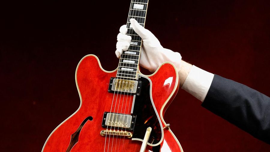 The Oasis band member Noel Gallagher's Gibson ES-355 guitar, destroyed during an argument with his brother at Paris' Rock en Seine festival in 2009, is displayed during a media preview at Hotel Drouot ahead of the auction in Paris, France, May 13, 2022. REUTERS/Benoit Tessier