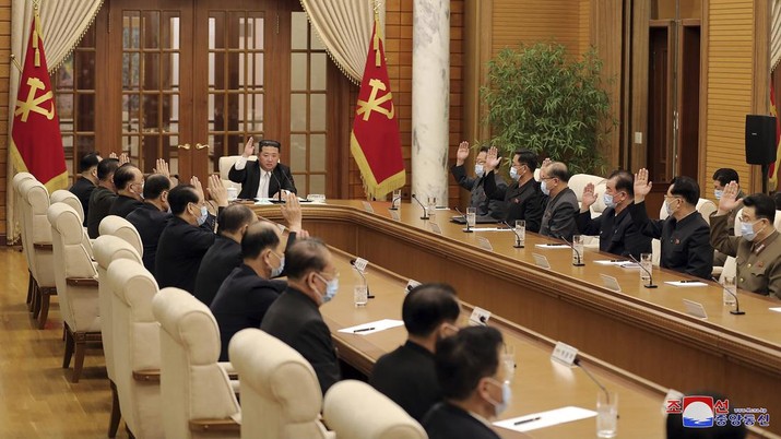 In this photo provided by the North Korean government, North Korean leader Kim Jong Un, center, attends a meeting of the Central Committee of the ruling Workers' Party in Pyongyang, North Korea Thursday, May 12, 2022. Independent journalists were not given access to cover the event depicted in this image distributed by the North Korean government. The content of this image is as provided and cannot be independently verified.   Korean language watermark on image as provided by source reads: 