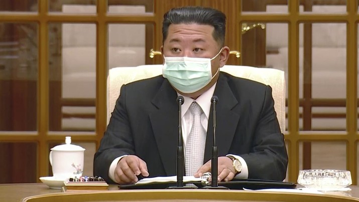 Virus Outbreak North Korea In this image made from video broadcasted by North Korea's KRT, North Korean leader Kim Jong Un wears a face mask on state television during a meeting acknowledging the country's first case of COVID-19 Thursday, May 12, 2022, in Pyongyang, North Korea. North Korea imposed a nationwide lockdown Thursday to control its first acknowledged COVID-19 outbreak after holding for more than two years to a widely doubted claim of a perfect record keeping out the virus that has spread to nearly every place in the world. (KRT via AP)