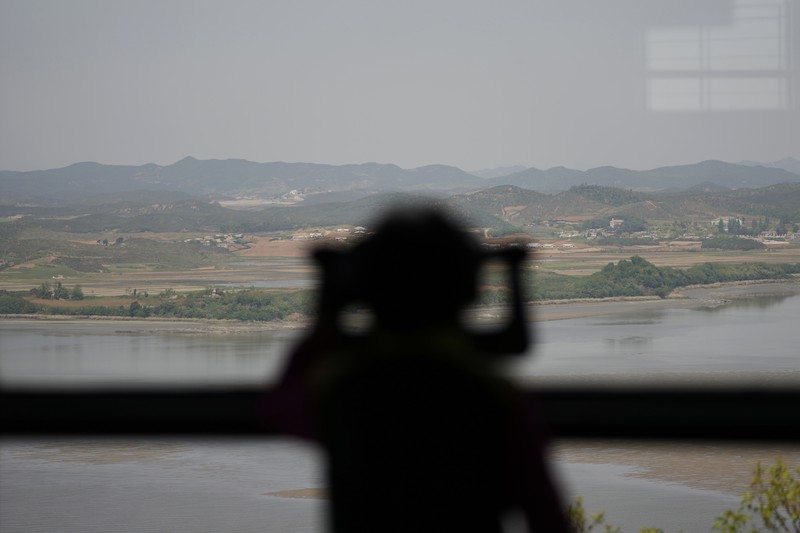 In this image made from video broadcasted by North Korea's KRT, North Korean leader Kim Jong Un wears a face mask on state television during a meeting acknowledging the country's first case of COVID-19 Thursday, May 12, 2022, in Pyongyang, North Korea. North Korea imposed a nationwide lockdown Thursday to control its first acknowledged COVID-19 outbreak after holding for more than two years to a widely doubted claim of a perfect record keeping out the virus that has spread to nearly every place in the world. (KRT via AP)