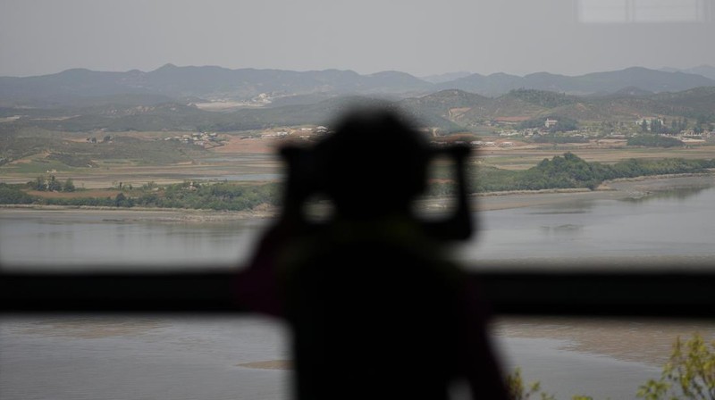 In this image made from video broadcasted by North Korea's KRT, North Korean leader Kim Jong Un wears a face mask on state television during a meeting acknowledging the country's first case of COVID-19 Thursday, May 12, 2022, in Pyongyang, North Korea. North Korea imposed a nationwide lockdown Thursday to control its first acknowledged COVID-19 outbreak after holding for more than two years to a widely doubted claim of a perfect record keeping out the virus that has spread to nearly every place in the world. (KRT via AP)