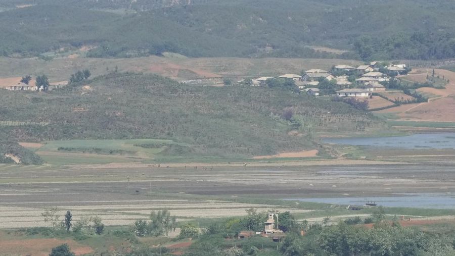 North Korea's Kaepoong town is seen from the unification observatory in Paju, South Korea, Friday, May 13, 2022. North Korea said Friday that six people died and 350,000 have been treated for a fever that has spread 