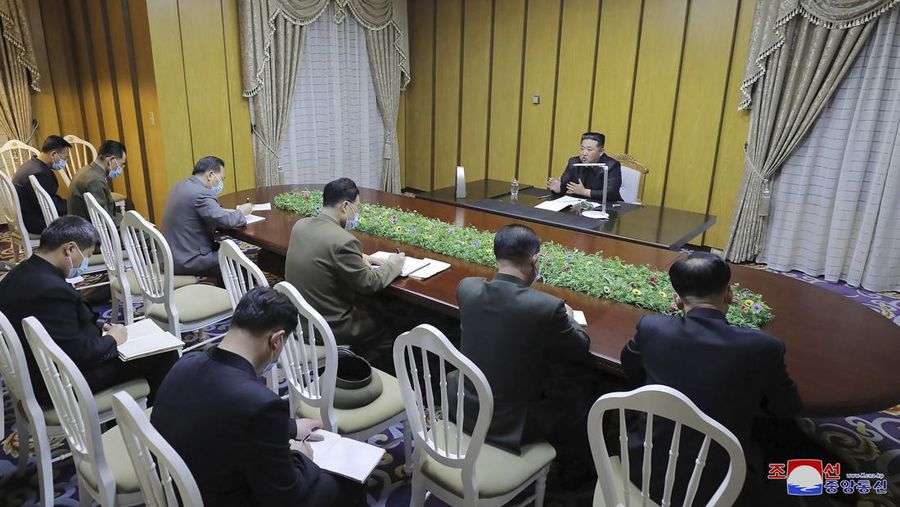 In this photo provided by the North Korean government, North Korean leader Kim Jong Un, top, visits state emergency epidemic prevention headquarters in North Korea Thursday, May 12, 2022. Independent journalists were not given access to cover the event depicted in this image distributed by the North Korean government. The content of this image is as provided and cannot be independently verified.   Korean language watermark on image as provided by source reads: 