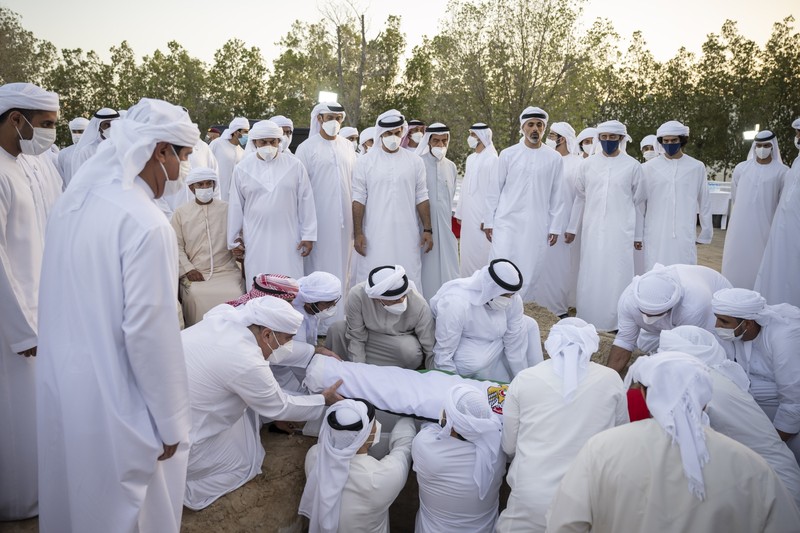 Emirates Leader Funeral This photo made available by the Ministry of Presidential Affairs, shows UAE Crown Prince Sheikh Mohamed bin Zayed Al Nahyan, ruler of Abu Dhabi, front right, and Sheikh Mansour bin Zayed Al Nahyan, UAE Deputy Prime Minister and Minister of Presidential Affairs, front left, carry the body of Sheikh Khalifa bin Zayed Al Nahyan, president of the United Arab Emirates, with other members of royal family at Sheikh Sultan bin Zayed The First mosque, in Abu Dhabi, Friday, May 13, 2022. (Abdulla Al Neyadi/Ministry of Presidential Affairs via AP)