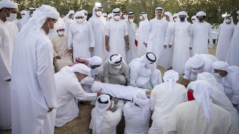 This photo made available by the Ministry of Presidential Affairs, shows Sheikh Mohamed bin Zayed Al Nahyan, ruler of Abu Dhabi, front left, and Sheikh Mansour bin Zayed Al Nahyan, UAE Deputy Prime Minister and Minister of Presidential Affairs, front right, carry the body of Sheikh Khalifa bin Zayed Al Nahyan, president of the United Arab Emirates, with other members of royal family at Sheikh Sultan bin Zayed The First mosque, in Abu Dhabi, Friday, May 13, 2022. (Hamad Al Kaabi/Ministry of Presidential Affairs via AP)