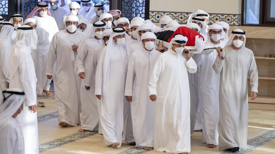 This photo made available by the Ministry of Presidential Affairs, shows Sheikh Mohamed bin Zayed Al Nahyan, ruler of Abu Dhabi, front left, and Sheikh Mansour bin Zayed Al Nahyan, UAE Deputy Prime Minister and Minister of Presidential Affairs, front right, carry the body of Sheikh Khalifa bin Zayed Al Nahyan, president of the United Arab Emirates, with other members of royal family at Sheikh Sultan bin Zayed The First mosque, in Abu Dhabi, Friday, May 13, 2022. (Hamad Al Kaabi/Ministry of Presidential Affairs via AP)