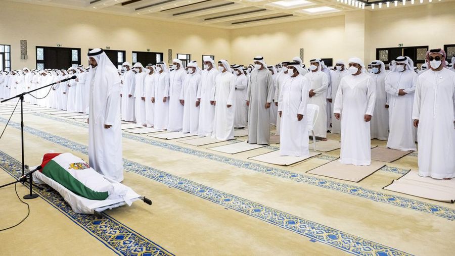 This photo made available by the Ministry of Presidential Affairs, shows Sheikh Mohamed bin Zayed Al Nahyan, ruler of Abu Dhabi, front left, and Sheikh Mansour bin Zayed Al Nahyan, UAE Deputy Prime Minister and Minister of Presidential Affairs, front right, carry the body of Sheikh Khalifa bin Zayed Al Nahyan, president of the United Arab Emirates, with other members of royal family at Sheikh Sultan bin Zayed The First mosque, in Abu Dhabi, Friday, May 13, 2022. (Hamad Al Kaabi/Ministry of Presidential Affairs via AP)