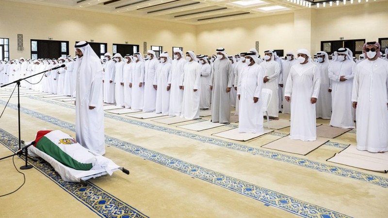 This photo made available by the Ministry of Presidential Affairs, shows Sheikh Mohamed bin Zayed Al Nahyan, ruler of Abu Dhabi, front left, and Sheikh Mansour bin Zayed Al Nahyan, UAE Deputy Prime Minister and Minister of Presidential Affairs, front right, carry the body of Sheikh Khalifa bin Zayed Al Nahyan, president of the United Arab Emirates, with other members of royal family at Sheikh Sultan bin Zayed The First mosque, in Abu Dhabi, Friday, May 13, 2022. (Hamad Al Kaabi/Ministry of Presidential Affairs via AP)
