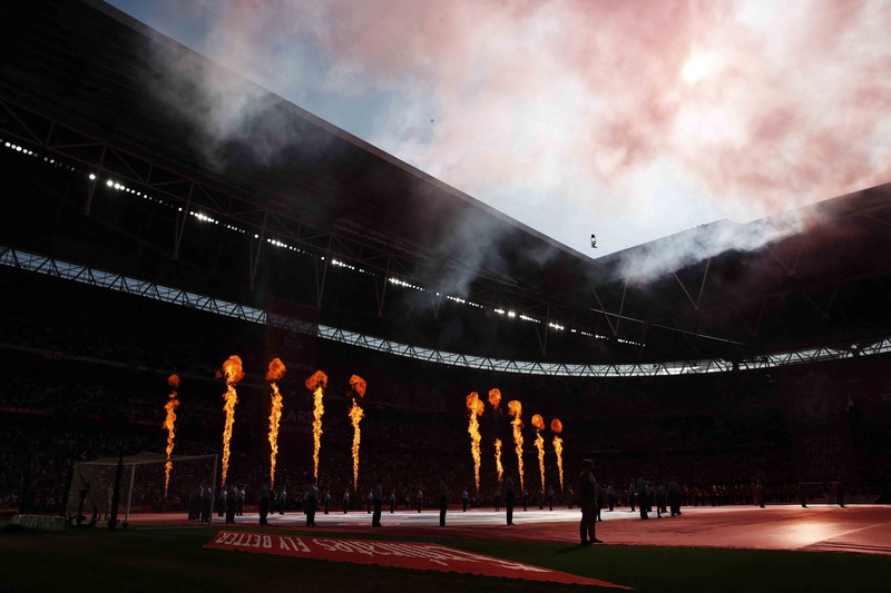 Liverpool players hold the trophy and celebrate after winning the English FA Cup final soccer match between Chelsea and Liverpool, at Wembley stadium, in London, Saturday, May 14, 2022. (AP Photo/Kirsty Wigglesworth)