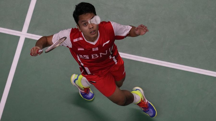 Indonesia's Anthony Ginting returns a shot to Japan's Kento Momota during their men's single semi-final match at Thomas & Uber Cup in Bangkok, Thailand, Friday, May 13, 2022. (AP Photo/Sakchai Lalit)