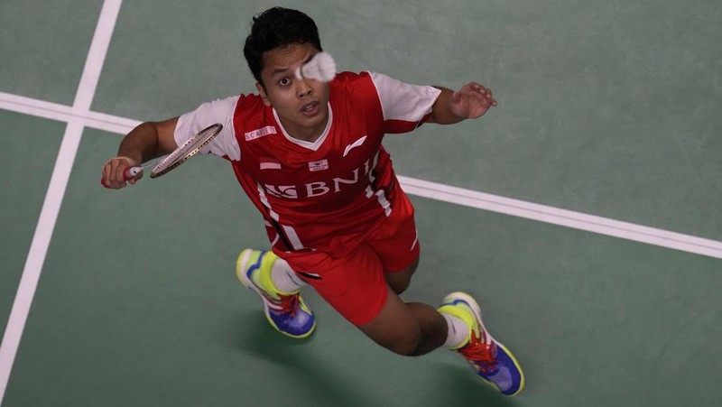 Indonesia's Anthony Ginting returns a shot to Japan's Kento Momota during their men's single semi-final match at Thomas & Uber Cup in Bangkok, Thailand, Friday, May 13, 2022. (AP Photo/Sakchai Lalit)