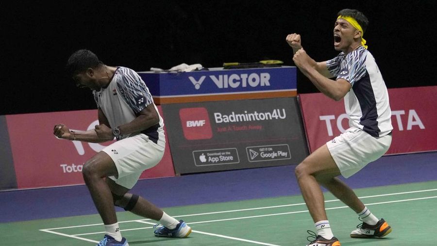 Indonesia's Anthony Ginting returns a shot to India's Lakshya Sen during their men's singles final badminton match at Thomas & Uber Cup in Bangkok, Thailand, Sunday, May 15, 2022. (AP Photo/Sakchai Lalit)