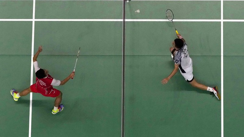 Indonesia's Anthony Ginting returns a shot to India's Lakshya Sen during their men's singles final badminton match at Thomas & Uber Cup in Bangkok, Thailand, Sunday, May 15, 2022. (AP Photo/Sakchai Lalit)