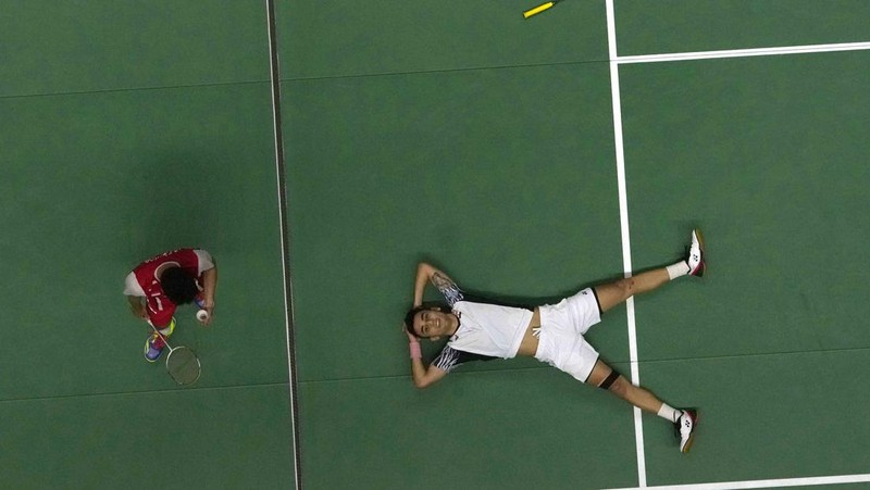 Indonesia's Anthony Ginting returns a shot to India's Lakshya Sen during their men's singles final badminton match at Thomas & Uber Cup in Bangkok, Thailand, Sunday, May 15, 2022. (AP Photo/Sakchai Lalit)