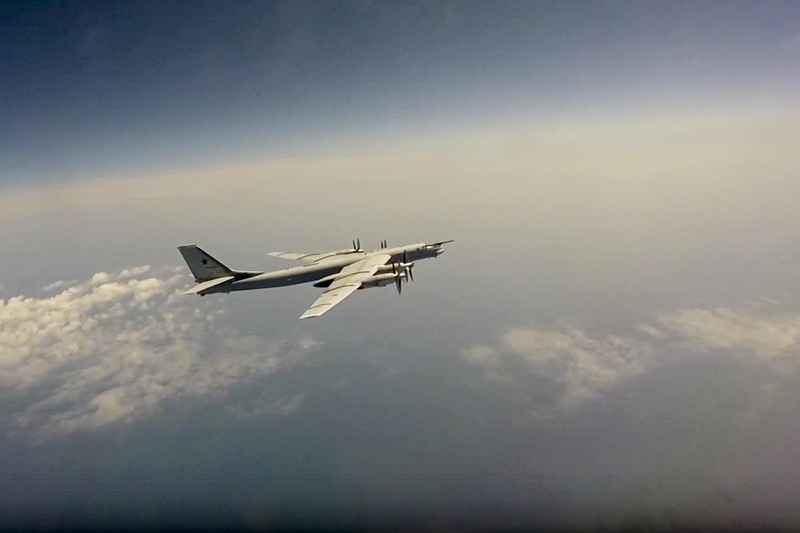 In this photo released by Russian Defense Ministry Press Service on Tuesday, May 24, 2022, A Tu-95 strategic bomber of the Russian air force flies on a mission at an undisclosed location. (Russian Defense Ministry Press Service via AP)