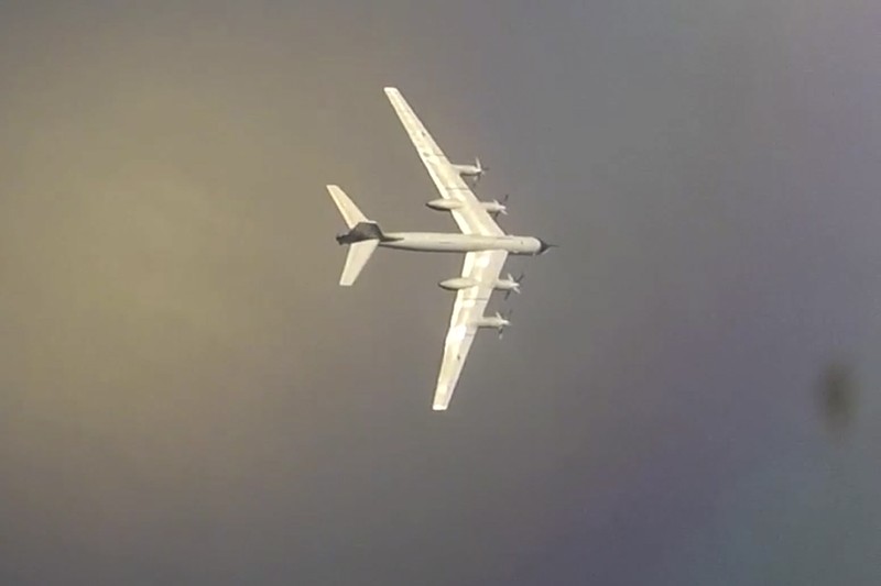 Russia Military In this photo released by Russian Defense Ministry Press Service on Tuesday, May 24, 2022, A Tu-95 strategic bomber of the Russian air force flies on a mission at an undisclosed location. (Russian Defense Ministry Press Service via AP)
