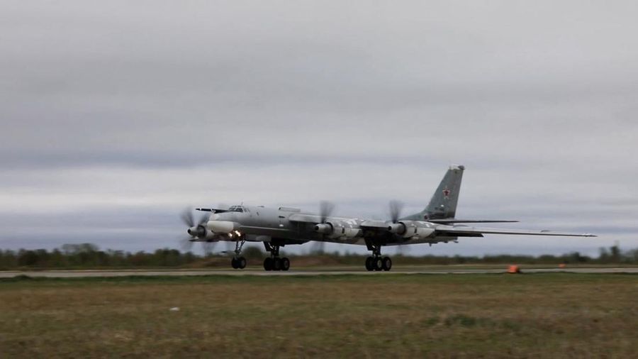 In this photo released by Russian Defense Ministry Press Service on Tuesday, May 24, 2022, A Tu-95 strategic bomber of the Russian air force flies on a mission at an undisclosed location. (Russian Defense Ministry Press Service via AP)