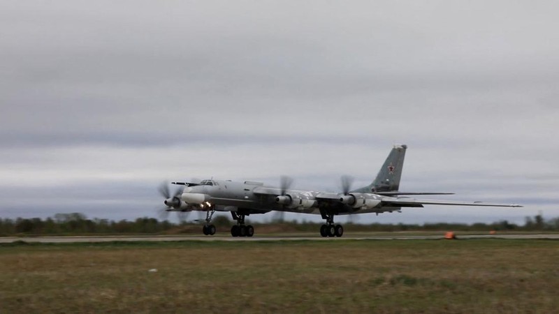 In this photo released by Russian Defense Ministry Press Service on Tuesday, May 24, 2022, A Tu-95 strategic bomber of the Russian air force flies on a mission at an undisclosed location. (Russian Defense Ministry Press Service via AP)