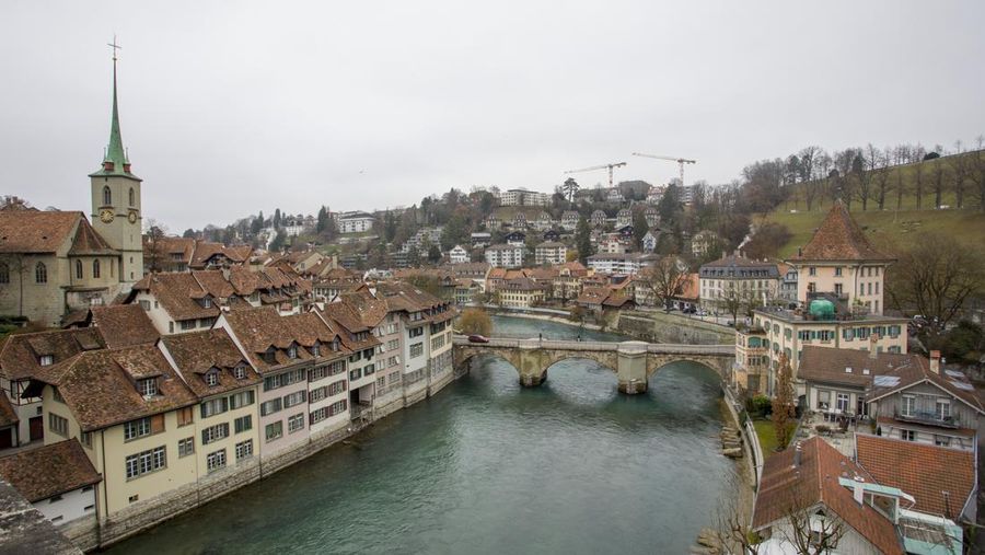 BERN, SWITZERLAND - JANUARY 01 : Panoramic view of  The old town the medieval city center of Bern and the Aare River on January 01, 2019 in Bern, Switzerland. The old town is the medieval city center of Bern. Bern is the capital city of Switzerland, is built around the Aare River.  Its origins back to the 12th century, with medieval architecture preserved in the Old Town. It is a UNESCO Cultural World Heritage Site since 1983 due to the compact and generally intact medieval core. (Photo by Athanasios Gioumpasis/Getty Images)