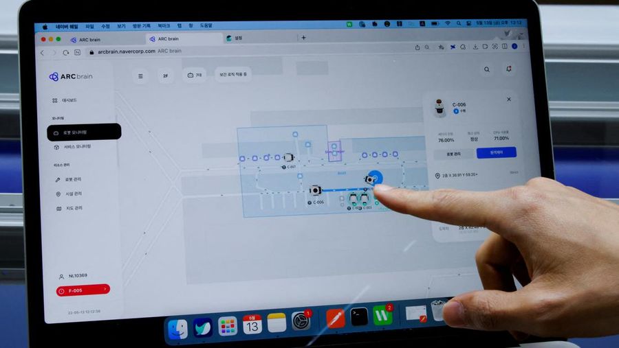 Robots using 5G networks charge at the Naver 1784 company office in Seongnam, South Korea, May 13, 2022. Picture taken May 13, 2022.  REUTERS/ Heo Ran