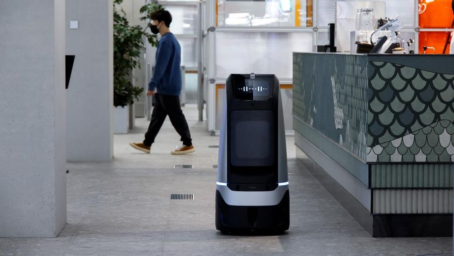 Robots using 5G networks charge at the Naver 1784 company office in Seongnam, South Korea, May 13, 2022. Picture taken May 13, 2022.  REUTERS/ Heo Ran