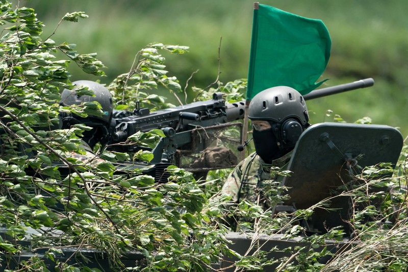 A Japan Ground Self-Defense Force (JGSDF) Type 10 battle tank fires ammunition during a live fire exercise at East Fuji Maneuver Area, in Gotemba, Shizuoka, Japan, May 28, 2022. Tomohiro Ohsumi/Pool via REUTERS