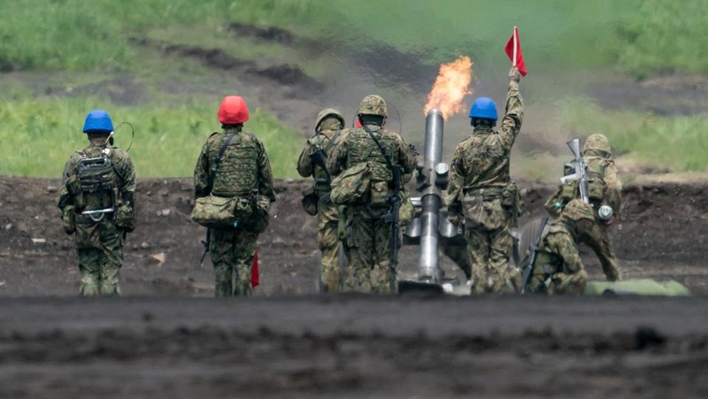 A Japan Ground Self-Defense Force (JGSDF) Type 10 battle tank fires ammunition during a live fire exercise at East Fuji Maneuver Area, in Gotemba, Shizuoka, Japan, May 28, 2022. Tomohiro Ohsumi/Pool via REUTERS