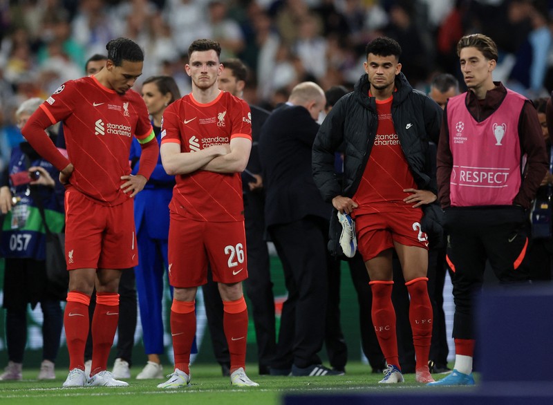 SOCCER-CHAMPIONS-LIV-MAD/REPORT Soccer Football - Champions League Final - Liverpool v Real Madrid - Stade de France, Saint-Denis near Paris, France - May 28, 2022 Real Madrid's Karim Benzema celebrates with the trophy and teammates after winning the Champions League REUTERS/Gonzalo Fuentes
