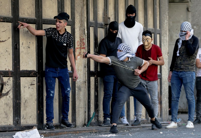 Puluhan ribu nasionalis ikut dalam Pawai Bendera Israel pada Minggu (29/5) yang dianggap warga Palestina sebagai provokasi dan berpotensi memicu ketegangan. (AFP via Getty Images/GIL COHEN-MAGEN) Puluhan ribu nasionalis ikut dalam Pawai Bendera Israel pada Minggu (29/5) yang dianggap warga Palestina sebagai provokasi dan berpotensi memicu ketegangan. (AFP via Getty Images/GIL COHEN-MAGEN)