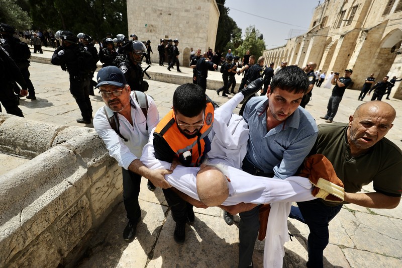 Puluhan ribu nasionalis ikut dalam Pawai Bendera Israel pada Minggu (29/5) yang dianggap warga Palestina sebagai provokasi dan berpotensi memicu ketegangan. (AFP via Getty Images/GIL COHEN-MAGEN) Puluhan ribu nasionalis ikut dalam Pawai Bendera Israel pada Minggu (29/5) yang dianggap warga Palestina sebagai provokasi dan berpotensi memicu ketegangan. (AFP via Getty Images/GIL COHEN-MAGEN)