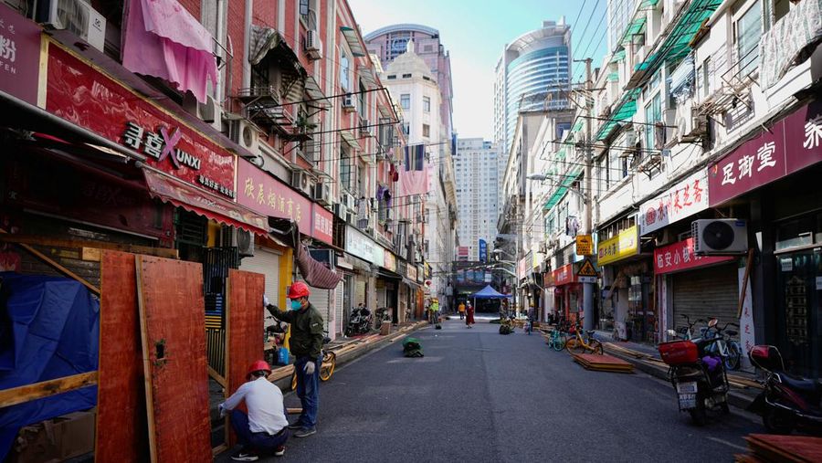 Workers dismantle barriers at a residential area, as the city prepares to end the lockdown placed to curb the coronavirus disease (COVID-19) outbreak in Shanghai, China May 31, 2022. REUTERS/Aly Song