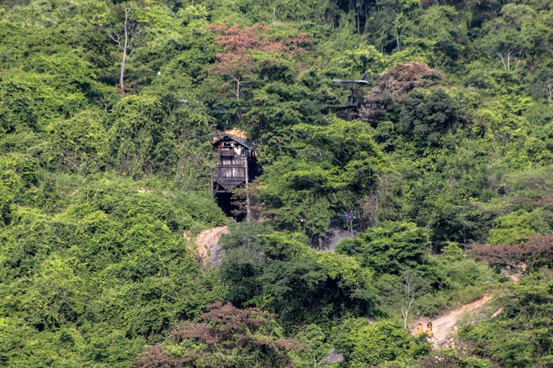 COLOMBIA-MINING-ACCIDENT Aerial view showing the entrance to the coal mine in the Colombian municipality of Zulia, Norte de Santander Department, on the border with Venezuela, in which 14 miners are still trapped on June 1, 2022. - Rescuers were continuing on Wednesday to try to free 14 miners trapped for two days in a coal mine in Colombia following an explosion that killed one worker, official sources said. The miners are believed to be 200 meters underground with rescuers attempting to dig down 55 meters to access a ventilation circuit