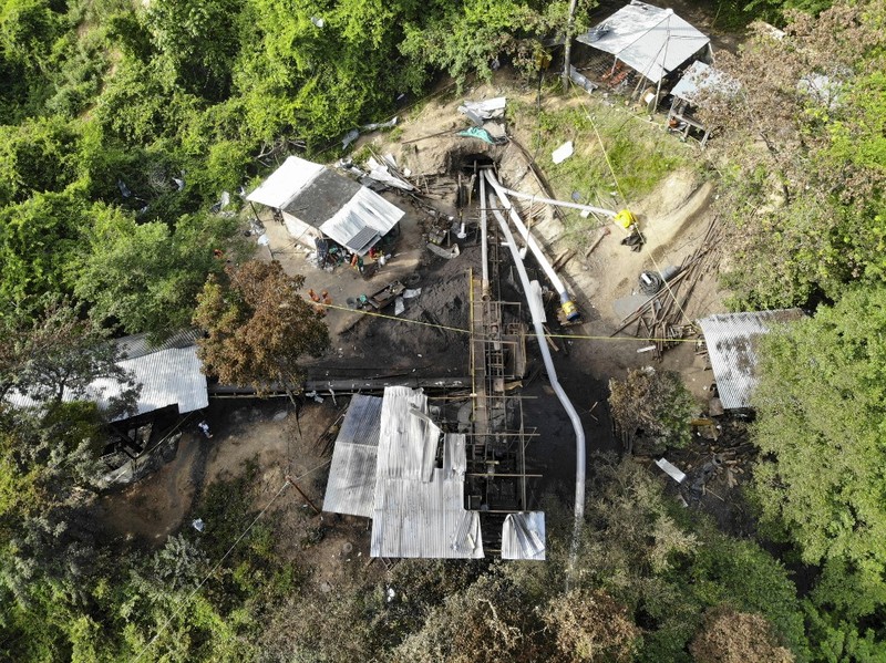 COLOMBIA-MINING-ACCIDENT Aerial view showing the entrance to the coal mine in the Colombian municipality of Zulia, Norte de Santander Department, on the border with Venezuela, in which 14 miners are still trapped on June 1, 2022. - Rescuers were continuing on Wednesday to try to free 14 miners trapped for two days in a coal mine in Colombia following an explosion that killed one worker, official sources said. The miners are believed to be 200 meters underground with rescuers attempting to dig down 55 meters to access a ventilation circuit