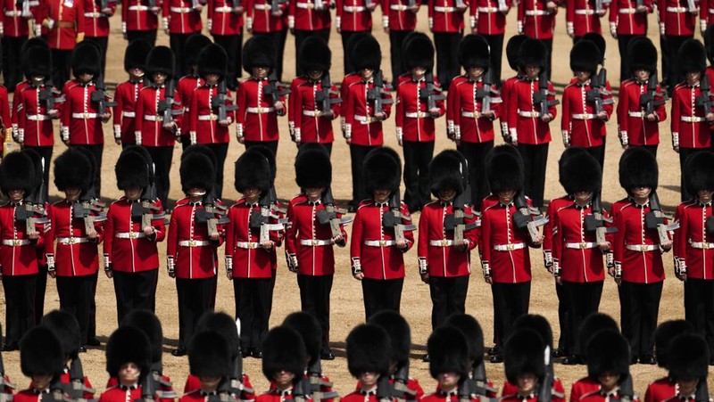 Members of the public fill The Mall ahead of a flypast over Buckingham Palace, during the Trooping the Color in London, Thursday, June 2, 2022, on the first of four days of celebrations to mark the Platinum Jubilee. The events over a long holiday weekend in the U.K. are meant to celebrate the monarch's 70 years of service. (Paul Ellis/Pool Photo via AP)