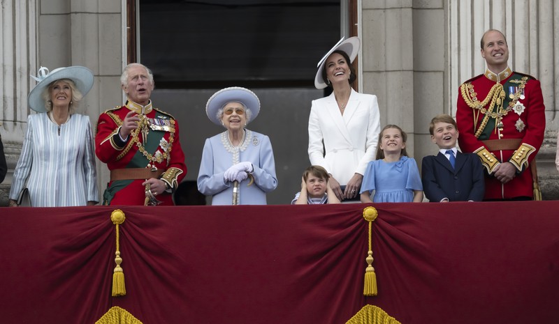 Members of the public fill The Mall ahead of a flypast over Buckingham Palace, during the Trooping the Color in London, Thursday, June 2, 2022, on the first of four days of celebrations to mark the Platinum Jubilee. The events over a long holiday weekend in the U.K. are meant to celebrate the monarch's 70 years of service. (Paul Ellis/Pool Photo via AP)